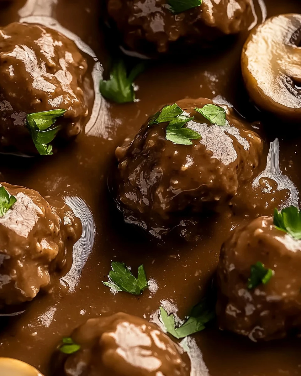 Salisbury Steak Meatballs with hearty mushroom gravy on a plate